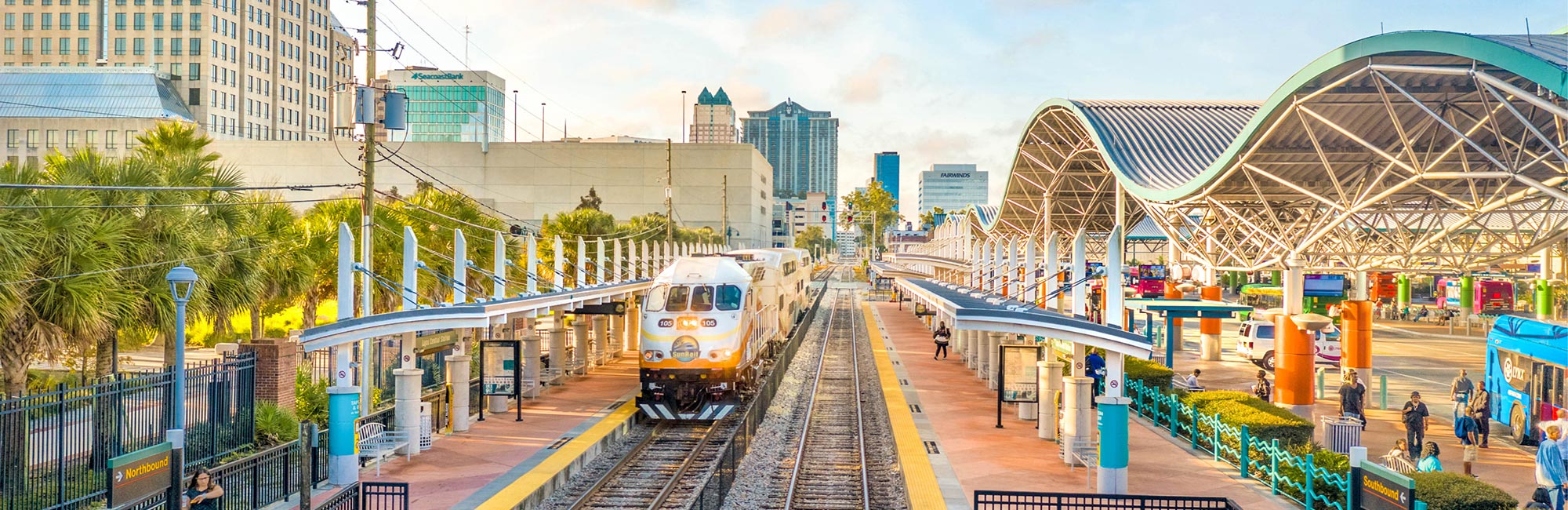 Slideshow: Sunrail train at Lynx Central Station showing train platform and bus tranportation.